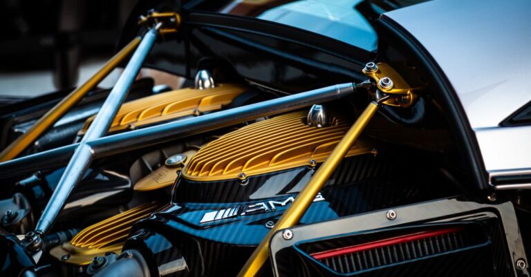 Detailed view of a luxury hypercar engine with gold and carbon fiber elements.