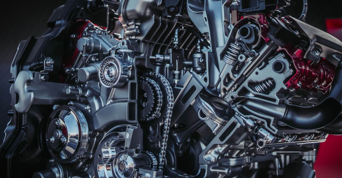 Detailed close-up of a modern metallic car engine with intricate components.