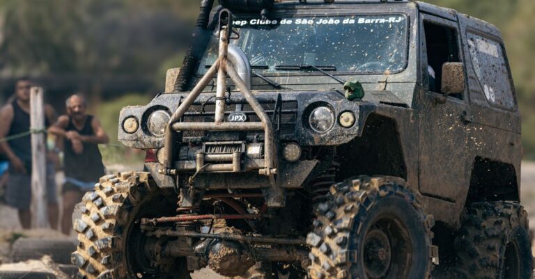 A rugged off-road jeep conquering muddy terrain during a thrilling rally event.