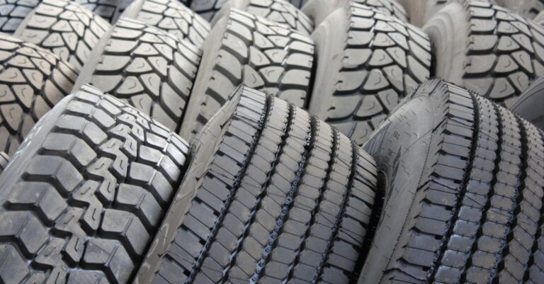 High-quality image of stacked industrial tires showcasing tread patterns.