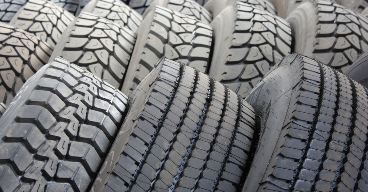 High-quality image of stacked industrial tires showcasing tread patterns.