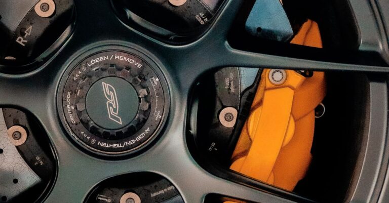Detailed view of a high-performance car wheel and brake system in Dubai, emphasizing precision engineering.