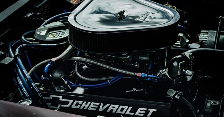 Detailed close-up of a Chevrolet engine showcasing performance parts and intricate mechanics.